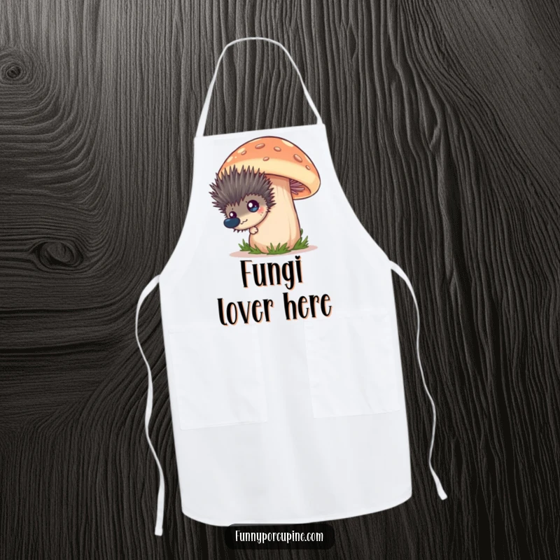 Funny apron showing a spiky porcupine peeking from behind a giant mushroom, its expression comically surprised and curious.