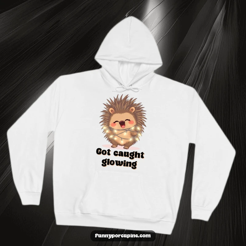 Funny porcupine fairy light hoodie, featuring a porcupine chuckling while delightfully entangled in luminous fairy lights.